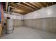 Unfinished basement with concrete flooring and exposed ceiling beams at 908 Oak Terrace Rd, Westfield, IN 46074