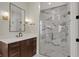 Luxurious bathroom featuring a walk-in shower with marble tiling, modern fixtures, and a sleek vanity at 908 Oak Terrace Rd, Westfield, IN 46074