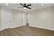 This bedroom features light-colored walls, hardwood floors, and two doors for easy access at 908 Oak Terrace Rd, Westfield, IN 46074