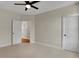 Bedroom with two white doors, neutral carpet, and a modern ceiling fan at 908 Oak Terrace Rd, Westfield, IN 46074