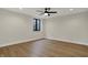 This bedroom features a modern ceiling fan, hardwood floors, and a window for natural light at 908 Oak Terrace Rd, Westfield, IN 46074