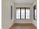 Bedroom with views of the outdoors through black-trimmed windows at 908 Oak Terrace Rd, Westfield, IN 46074