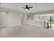 Large bonus room featuring carpeted floors, a ceiling fan, and a view to the stairs at 908 Oak Terrace Rd, Westfield, IN 46074