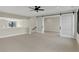 Cozy bonus room with sliding glass doors, carpeted floors and a ceiling fan at 908 Oak Terrace Rd, Westfield, IN 46074