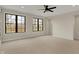 Bright bonus room featuring carpeted floors, a ceiling fan, and natural light at 908 Oak Terrace Rd, Westfield, IN 46074