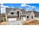 Beautiful brick two-story home with attached garage and manicured landscaping, perfect for Gathering living at 908 Oak Terrace Rd, Westfield, IN 46074