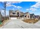 Charming two-story home with stone accents, attached garage, and well-maintained lawn in a lovely neighborhood at 908 Oak Terrace Rd, Westfield, IN 46074