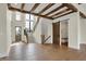 Inviting foyer with hardwood floors, a staircase, and convenient storage, offering a stylish welcome to the home at 908 Oak Terrace Rd, Westfield, IN 46074
