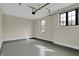 Spacious garage with epoxy flooring and two windows for natural light at 908 Oak Terrace Rd, Westfield, IN 46074