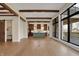 Spacious great room with hardwood floors, wooden beams and open concept kitchen at 908 Oak Terrace Rd, Westfield, IN 46074