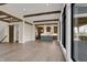 Spacious great room featuring dark wood beams, hardwood floors, and open access to the kitchen at 908 Oak Terrace Rd, Westfield, IN 46074