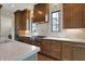 Well-lit kitchen featuring wood cabinets, stainless steel appliances, and a marble backsplash at 908 Oak Terrace Rd, Westfield, IN 46074