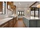 Kitchen with stainless appliances, island with seating and bar sink and marble countertops at 908 Oak Terrace Rd, Westfield, IN 46074