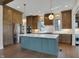 Island kitchen with pendant lights, stainless appliances, and custom cabinetry at 908 Oak Terrace Rd, Westfield, IN 46074