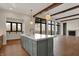 Kitchen island featuring a large countertop, stainless steel dishwasher and sink at 908 Oak Terrace Rd, Westfield, IN 46074