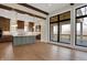 Open concept kitchen featuring an island, pendant lights, stainless appliances and access to the deck at 908 Oak Terrace Rd, Westfield, IN 46074