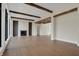 Elegant living area with hardwood floors, a fireplace, and expansive windows providing panoramic views of the backyard at 908 Oak Terrace Rd, Westfield, IN 46074