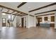 Bright, open-concept living room with hardwood floors, beamed ceilings, and modern finishes throughout at 908 Oak Terrace Rd, Westfield, IN 46074