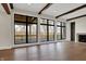 Bright living room featuring large windows, hardwood floors, fireplace and wooden beams at 908 Oak Terrace Rd, Westfield, IN 46074