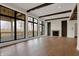 Bright living room with hardwood floors, a fireplace, and large windows showcasing the outdoor deck and natural surroundings at 908 Oak Terrace Rd, Westfield, IN 46074