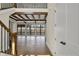 Spacious living area with hardwood floors, exposed beams, and large windows showcasing scenic views at 908 Oak Terrace Rd, Westfield, IN 46074
