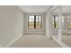 Compact office space with carpeted floors, natural light, and a sliding glass door at 908 Oak Terrace Rd, Westfield, IN 46074