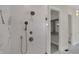 Modern shower featuring chrome shower head and fixtures, and white and gray marble tile surround at 908 Oak Terrace Rd, Westfield, IN 46074