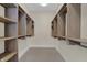 Spacious walk-in closet with custom built-in shelving and hanging rods for optimal storage at 908 Oak Terrace Rd, Westfield, IN 46074