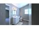 Clean bathroom with a modern vanity, a toilet, and a well-lit mirror at 9161 Warwick Rd, Indianapolis, IN 46240