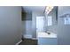 Well-lit bathroom with a modern vanity, mirror, and a bathtub with a shower at 9161 Warwick Rd, Indianapolis, IN 46240