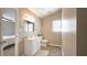 Bathroom featuring modern vanity, neutral paint, and sleek wood-look vinyl flooring at 9161 Warwick Rd, Indianapolis, IN 46240