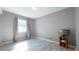 Bedroom with vinyl floors, window with curtains, and entertainment unit at 9161 Warwick Rd, Indianapolis, IN 46240