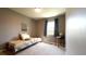 Cozy bedroom with a sunny window, neutral carpet, and charming decor for a relaxing atmosphere at 9161 Warwick Rd, Indianapolis, IN 46240