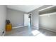 Bedroom features a view into another room, vinyl floors, and closet at 9161 Warwick Rd, Indianapolis, IN 46240
