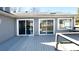 Home featuring a deck with three sliding glass doors at 9161 Warwick Rd, Indianapolis, IN 46240