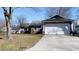 Charming single-story home with a two-car garage, complemented by a well-maintained front yard at 9161 Warwick Rd, Indianapolis, IN 46240