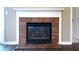 Cozy brick fireplace with a white mantle, adding warmth and charm to the room at 9161 Warwick Rd, Indianapolis, IN 46240