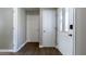 Bright hallway featuring three white doors, leading to different areas of the house at 9161 Warwick Rd, Indianapolis, IN 46240