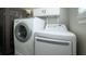 Bright laundry room featuring a modern washer and dryer at 9161 Warwick Rd, Indianapolis, IN 46240