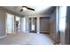 Inviting bedroom featuring carpet, a ceiling fan, closet organizer, and a window overlooking the backyard at 9161 Warwick Rd, Indianapolis, IN 46240
