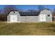 Yard featuring outbuilding with white doors at 9161 Warwick Rd, Indianapolis, IN 46240