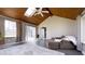 Sun room with vaulted ceilings, skylight, and sliding doors leading to the yard at 9161 Warwick Rd, Indianapolis, IN 46240