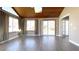 Inviting sunroom with wood ceilings, skylights, and access to a patio area at 9161 Warwick Rd, Indianapolis, IN 46240