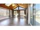 Bright sunroom with wood ceilings, skylights, and multiple windows overlooking the outdoors at 9161 Warwick Rd, Indianapolis, IN 46240