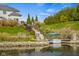 Beautiful backyard with a boat dock, landscaped greenery, and convenient access to the water at 995 Westlake Hills Dr, Columbus, IN 47201