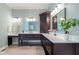 The bright bathroom features a dual vanity, elegant fixtures, and marble countertops at 995 Westlake Hills Dr, Columbus, IN 47201