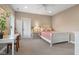 This bedroom boasts neutral tones, natural light, and a ceiling fan at 995 Westlake Hills Dr, Columbus, IN 47201