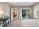 Light-filled bedroom with a view to the outdoor patio, desk, and modern interior at 995 Westlake Hills Dr, Columbus, IN 47201