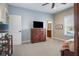 This bedroom boasts neutral tones, a ceiling fan, and plenty of natural light at 995 Westlake Hills Dr, Columbus, IN 47201