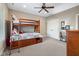 This bedroom features a ceiling fan and a bunk bed with plenty of storage at 995 Westlake Hills Dr, Columbus, IN 47201